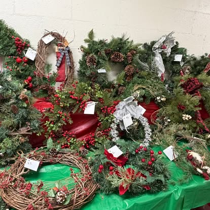 Holiday wreaths and festive decorations arranged for the sale